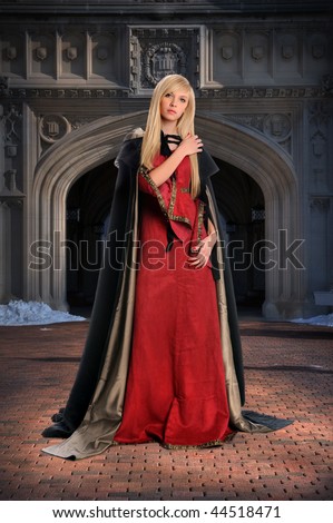 Beautiful Renaissance woman standing in front of castle
