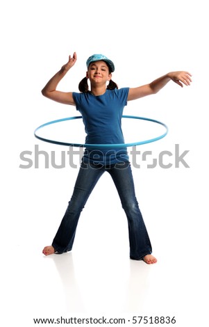 Young girl playing with hula hoop isolated over white background