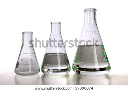 Laboratory flasks over white background with table reflections - With clipping path