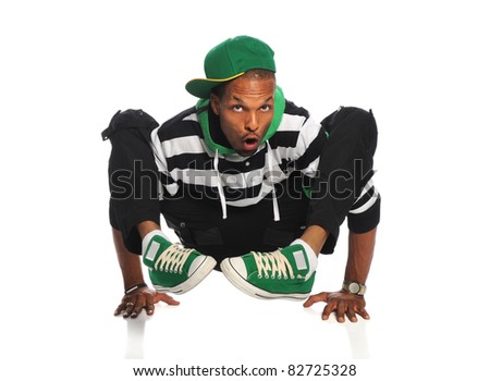 African American hip hop dancer balancing on hands isolated over white background
