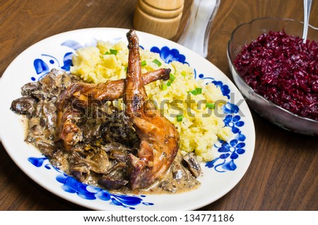 Rabbit in mushroom sauce with beetroots and potato puree