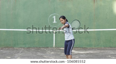 Female tennis player getting ready to hit forehand stroke
