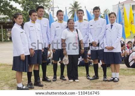 CHIYA,SURAT THANI  - JUNE 22 : Unidentified Thai students in ceremony uniform during sport parade on June 22, 2012 Chiya, Surat Thani, Thailand.