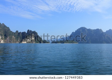 Cheow Larn Lake at Khao Sok National Park in Southern Thailand, beautiful view of mountains, hills, water