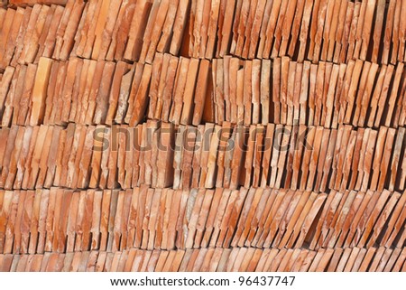 Detail of a red clay tile to repair a roof of temple in Thailand