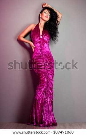 elegant fashionable woman in violet dress