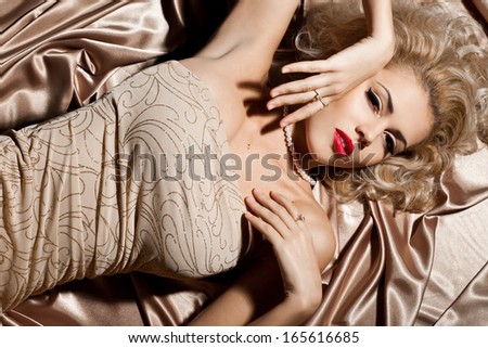 beautiful fashionable woman in beige clothes