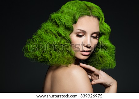 elegant fashionable woman with green hair