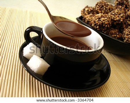 cup of chocolate with fresh-baked cookies