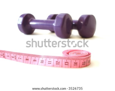 pink measuring tape and violet rubber dumbbell over white background
