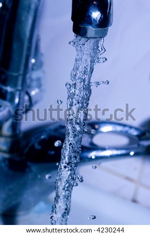 water  running down from faucet in blue color
