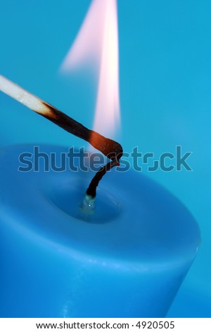 lighting of blue candle with match