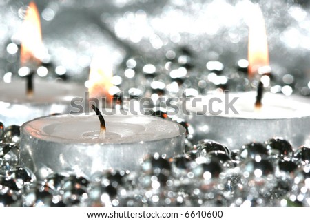 white candles with silver decoration balls