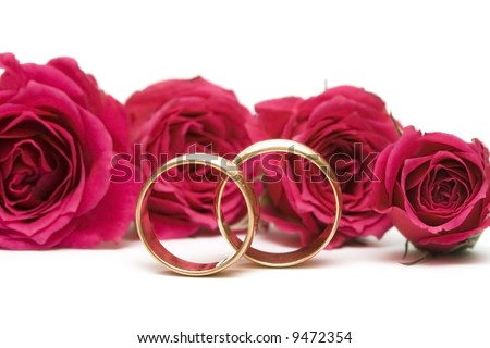 stock photo golden wedding rings with flowers