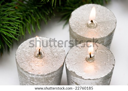 Silver festive candles with fur-tree