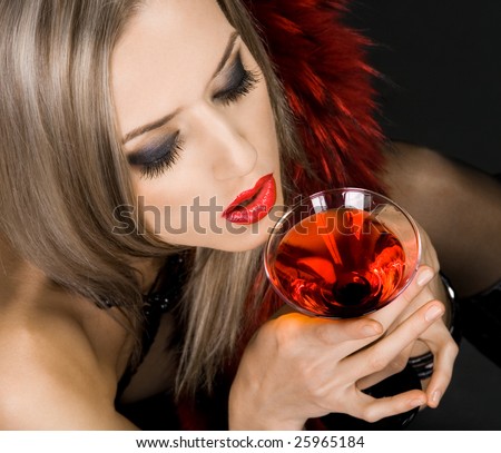 Beautiful woman with glass of cocktail