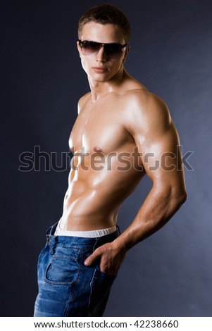 http://image.shutterstock.com/display_pic_with_logo/70306/70306,1260037563,2/stock-photo-young-bodybuilder-man-on-black-background-42238660.jpg