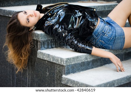 Beautiful woman in a leather jacket