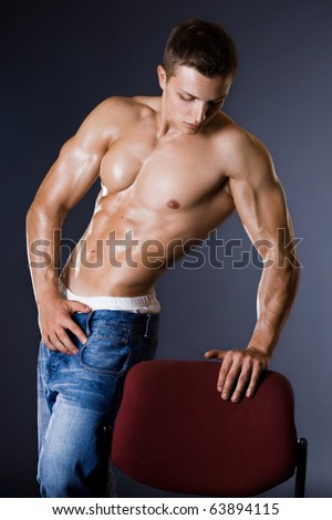 stock photo young bodybuilder man on black background