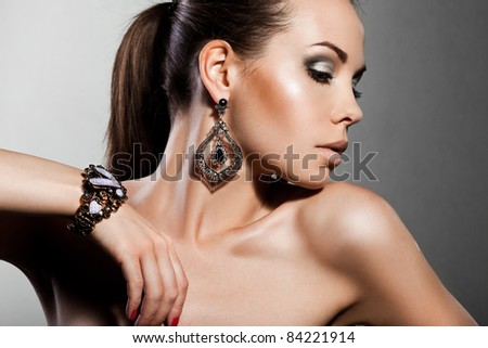 elegant fashionable woman with silver jewelry