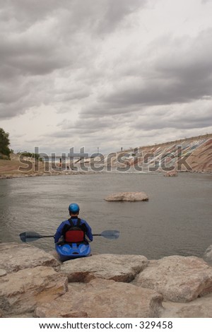 A kayaker gets ready to take the plunge into the man-made kayak run near downtown Pueblo, Co., on the Arkansas River.  Taken in May, 2005.