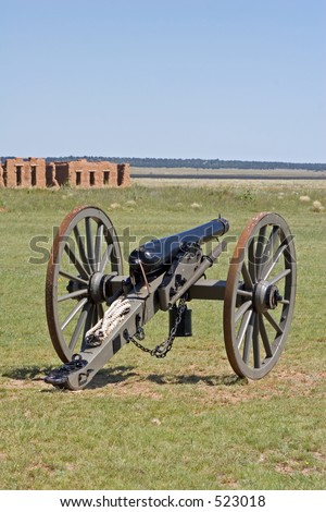 Civil War era cannon on the parade ground at Fort Union National Monument, north of Santa Fe, New Mexico - vertical orientation.