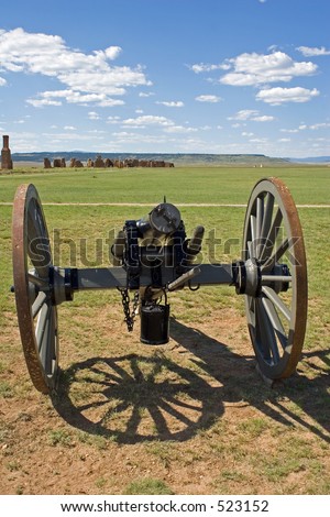 Civil war era cannon on the parade ground at old Fort Union National Monument, north of Santa Fe, New Mexico - vertical orientation.