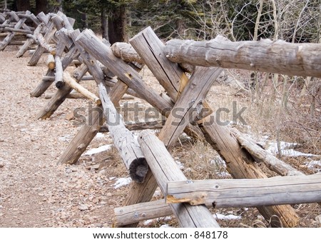 A handmade rail fence runs next to a trail on top of Sandia Peak in New Mexico.