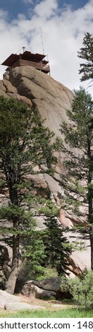 True vertical panorama of the fire lookout watchtower on top of the Devil\'s Head rock formation in central Colorado.