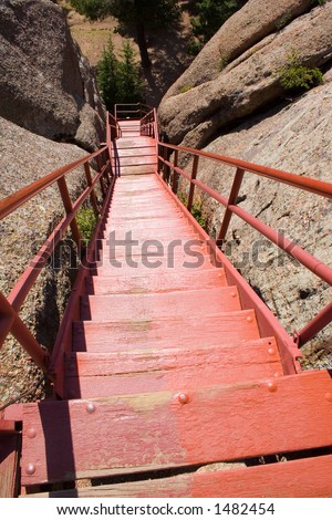 A long line of red steps lead the way down from the fire watchtower on Devil\'s Head in central Colorado