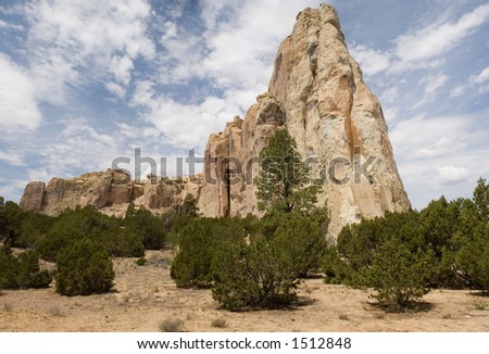 Wide and tall true panorama of the distinctive stone formations and mesa at El Morro National Monument in northwestern New Mexico