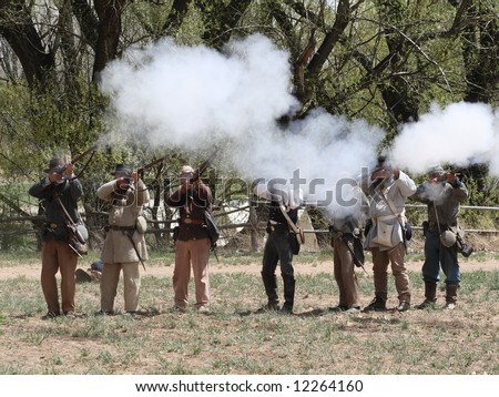 Smoke plumes from muzzle-loaders mark the battlefield in a Civil War reenactment even in New Mexico