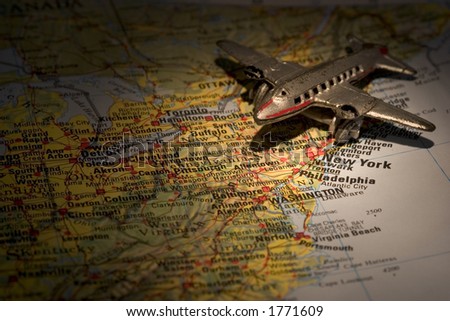 Old toy airplane on map of