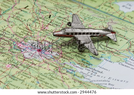 Toy Airplane on map of England.  Shallow depth of field from use of macro lens