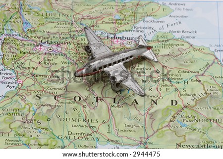 Toy Airplane on map of Scotland.  Shallow depth of field from use of macro lens