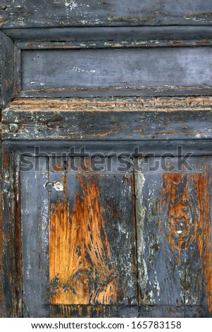 Decayed, rotten, old wood door close-up
