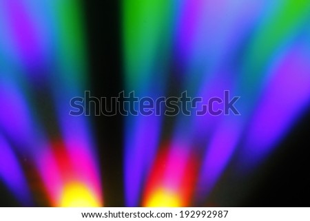 coloured light stripes on shiny plastic surface defocused