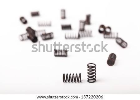 Many spring coils isolated on white background