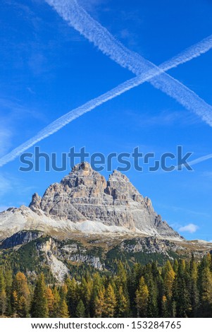 Vapor trails after flying machines above the Tre Cime Di Lavaredo