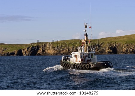 Tug vessel at the coastline
