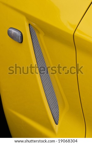 Blinker indicator and a air filter on a sports car