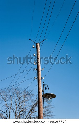 telephone pole with street lighting