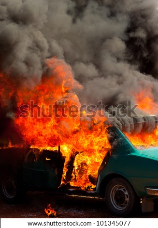 Exploded parking car on fire