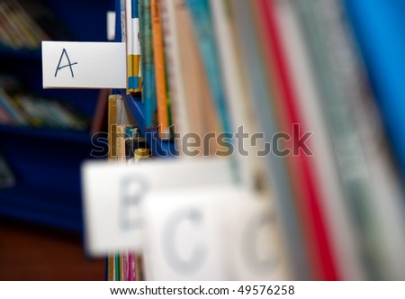 Books on bookshelf in library in a child corner