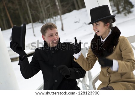 Man take off hat when woman making point