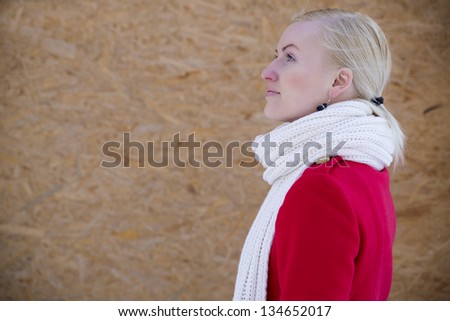 Young woman face profile with white woven scarf