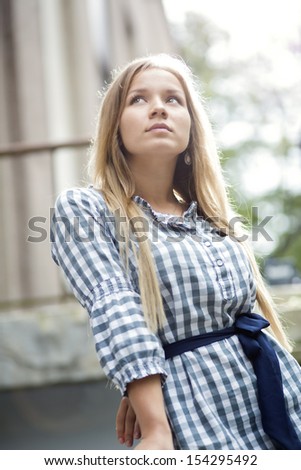 Woman in checkered dress dreaming about future events