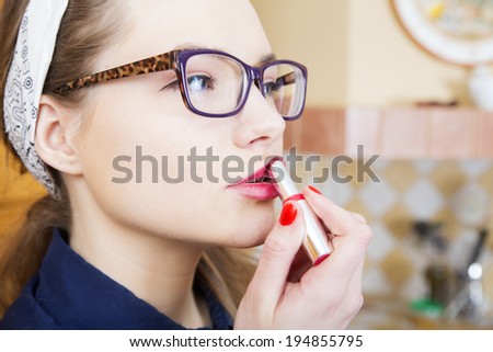 Woman at sexy suit stains pink upper lip
