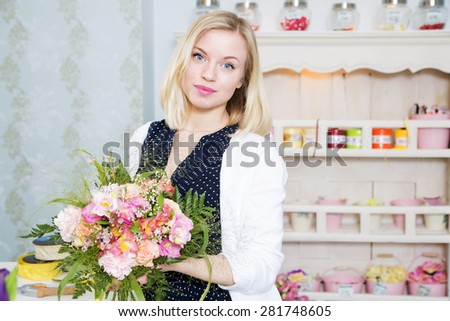 Young female with flowers in beautiful indoors