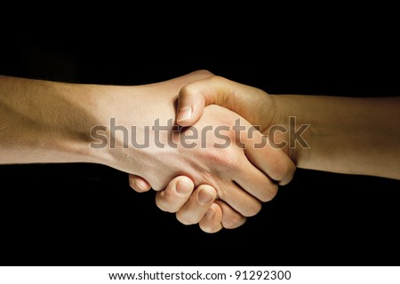 Lighted two hands unite with eachother as agreement